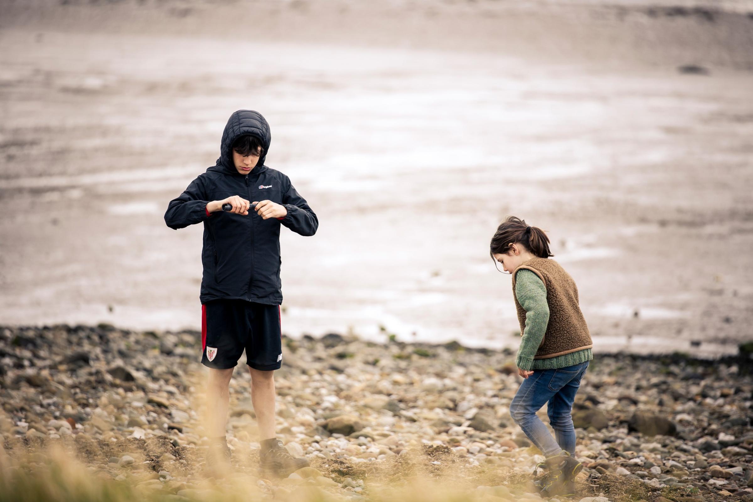 Two children playing on a beach