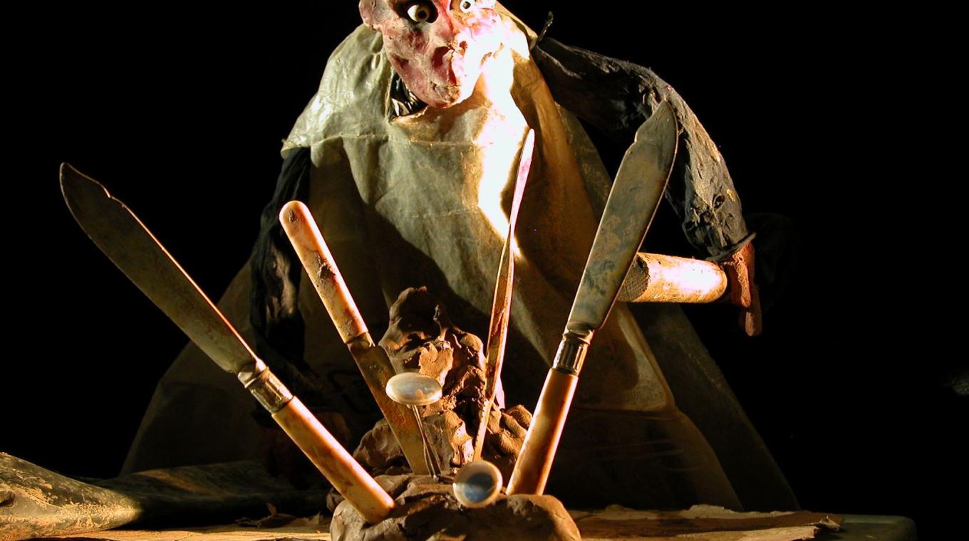 Clay Puppet in the background with modelling tools in the foreground