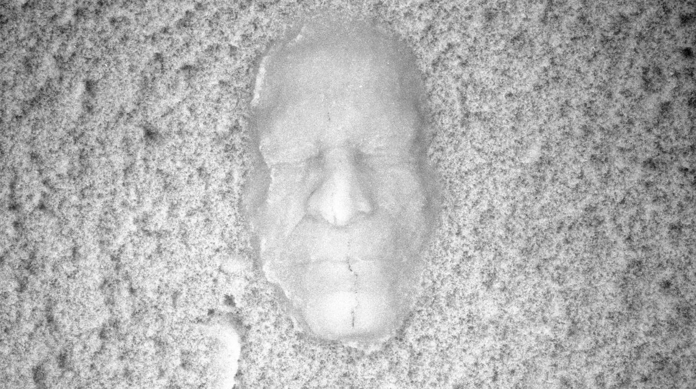 B&W image of a cast of a mans face