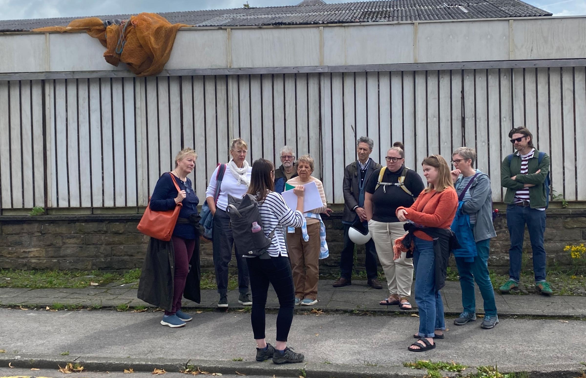A group of people gathered in the street