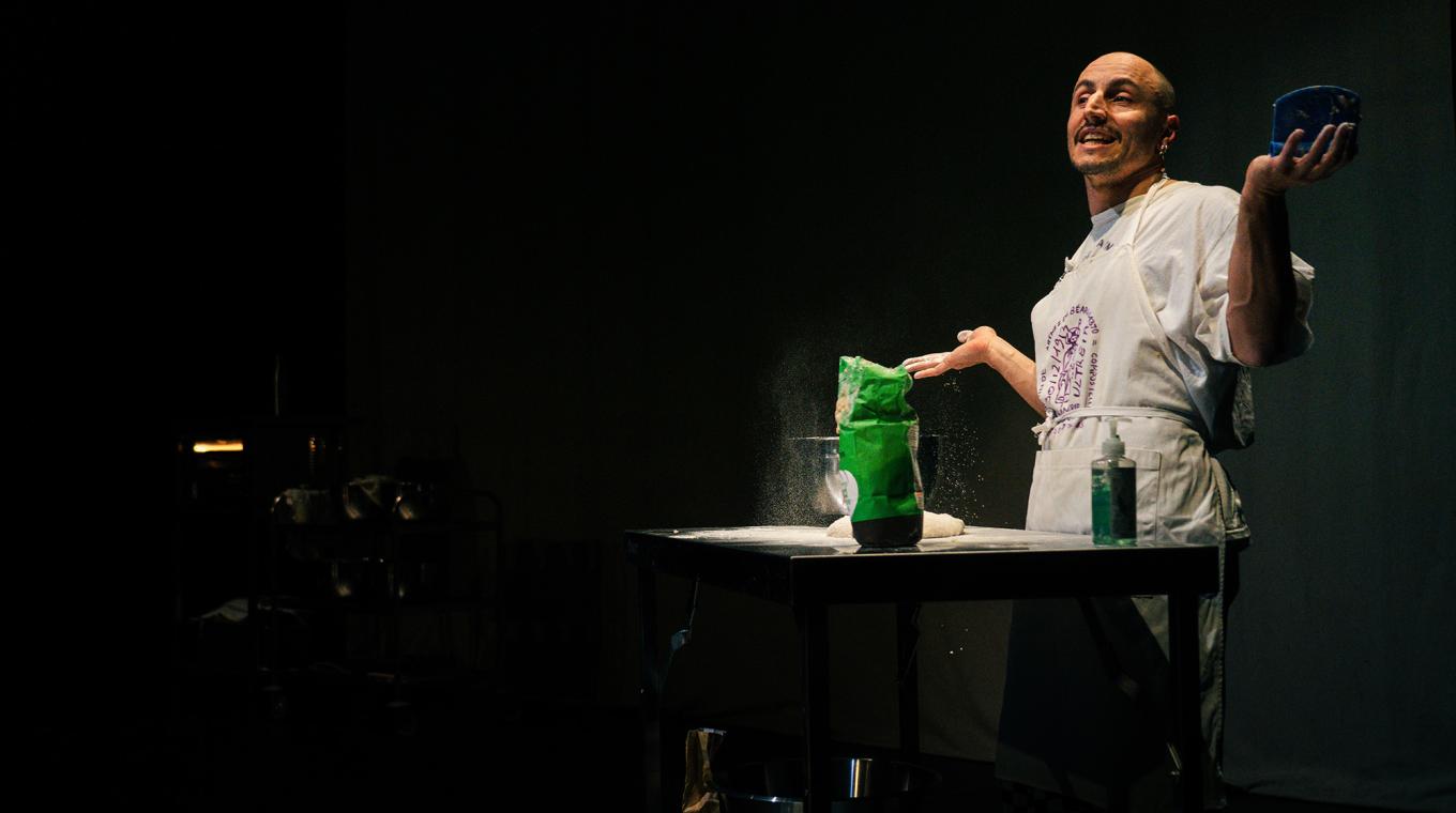 a man making bread on stage