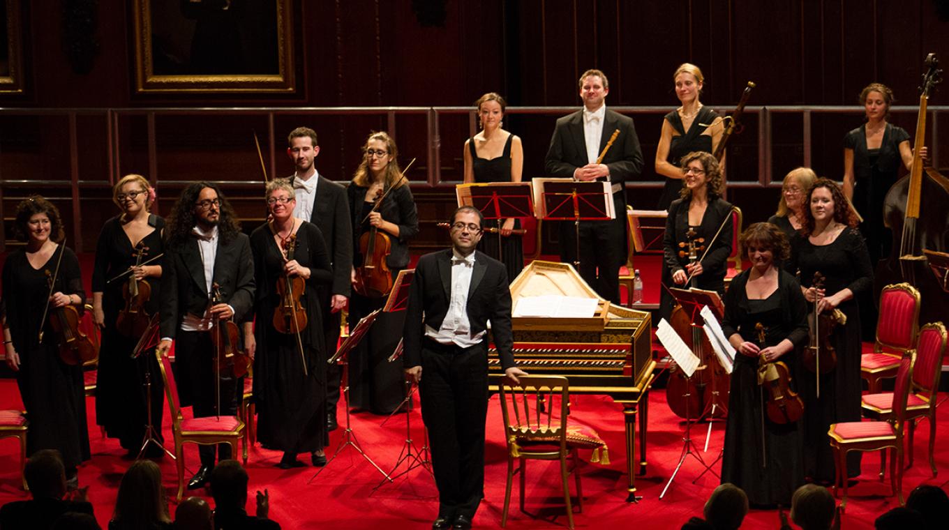 14 piece orchestra on stage facing the audience