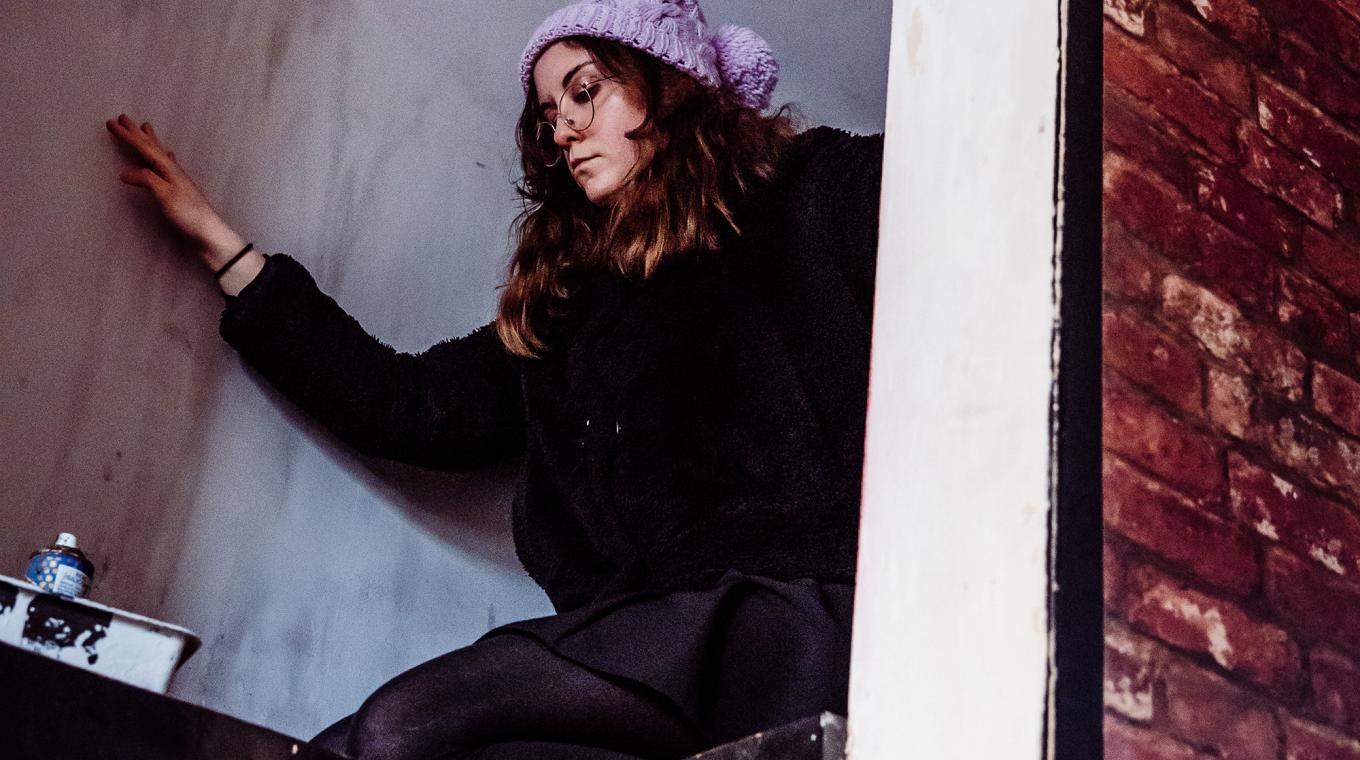 A woman on top of a counter